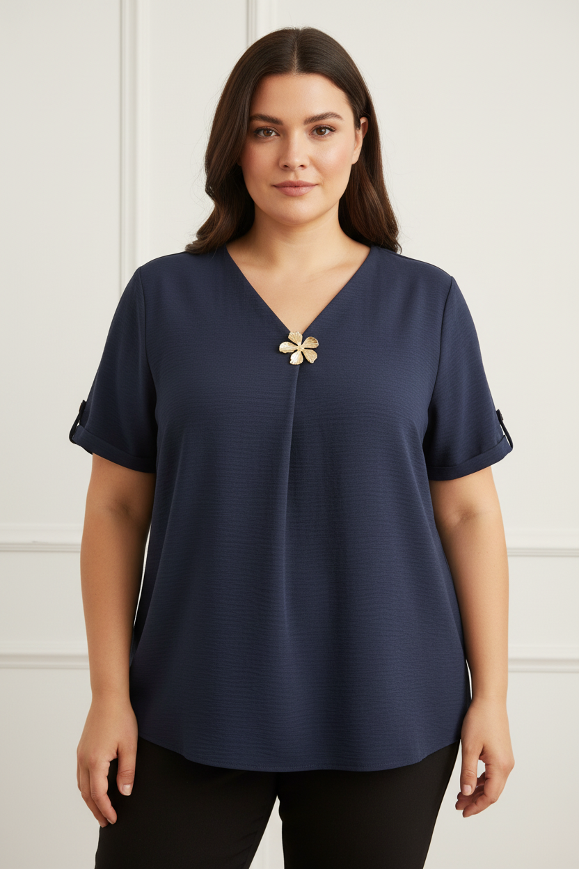 Blusa con fiore dorato